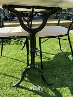Cast iron oval shaped bistro table with marble top