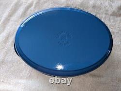 Le Creuset cast iron oval oven with reversible grill pan lid 4 3/4 in blue