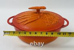 Technique Orange Enameled Cast Iron Oval Dutch Oven withCarrots Relief Lid 11 1/2