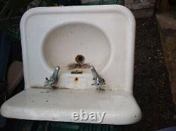 Vintage 1920s wall-mounted cast iron sink
